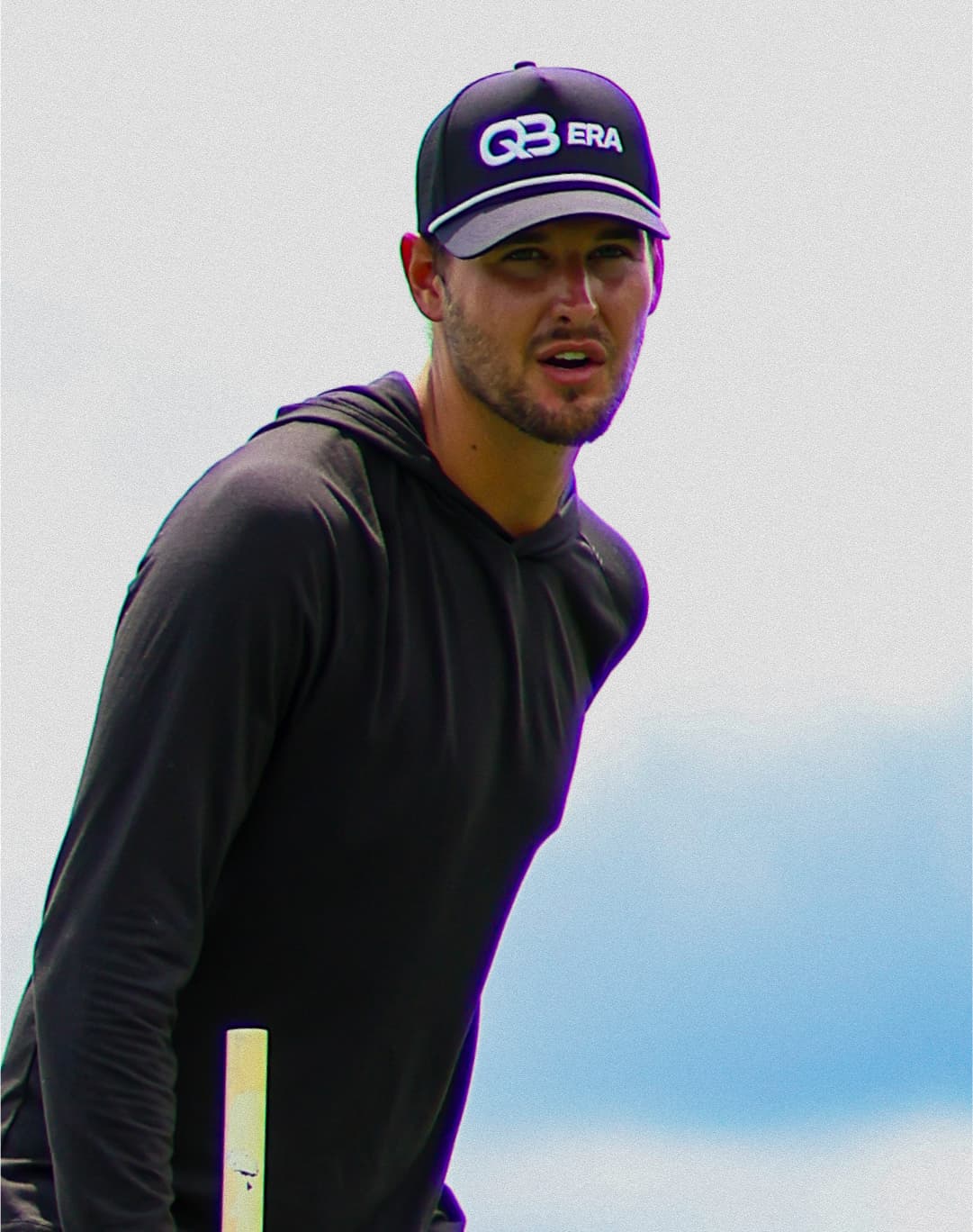 Coach Jarred Park critiquing a quarterback at a training session