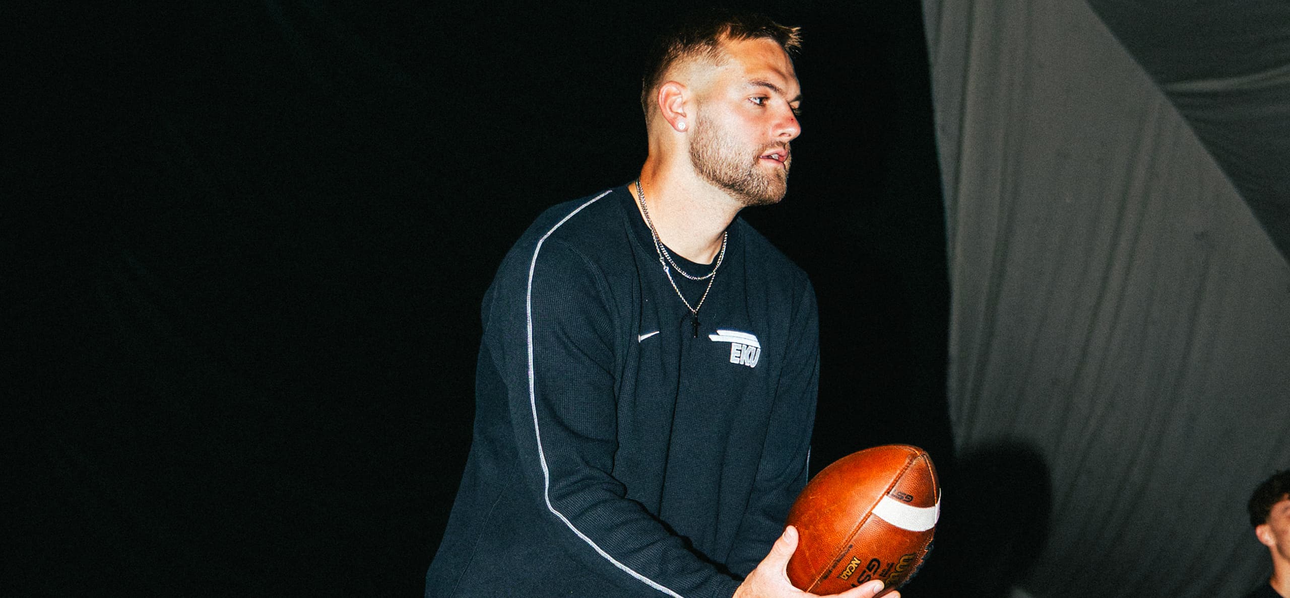 Matt Morrisey snapping a football to himself